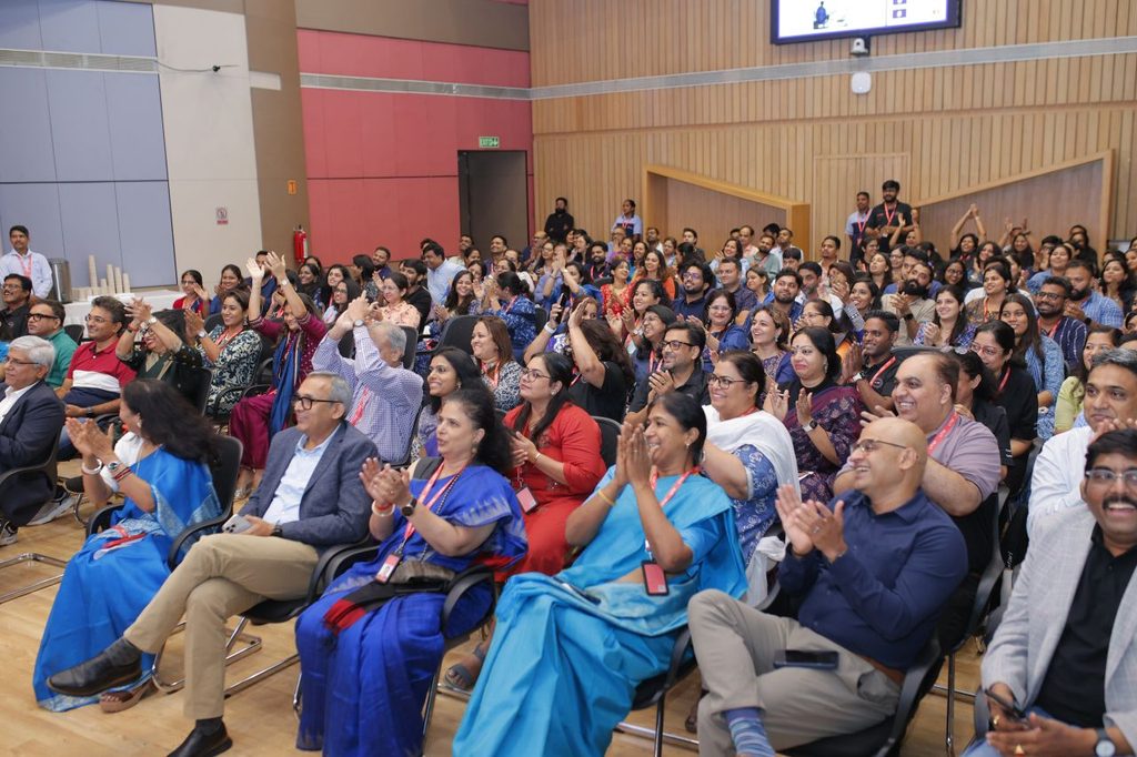 The audience appreciating the Quizmaster Ajay Poonia's yet another bad joke or a fine answer from the participants, one of the two